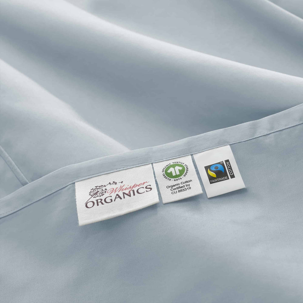 Close-up of organic and fair trade labels on a fabric surface. 100% GOTS-Certified &amp; Fairtrade-Certified Organic Cotton
Made in India
High quality, dense 500-thread-count sateen weave becomes luxuriously soft with washing
Durable elastic band
Non-toxic, hypoallergenic, naturally breathable, and cooling
16" deep pocket, ideal for plush mattresses
Easy Care, Machine Wash and Tumble Dry