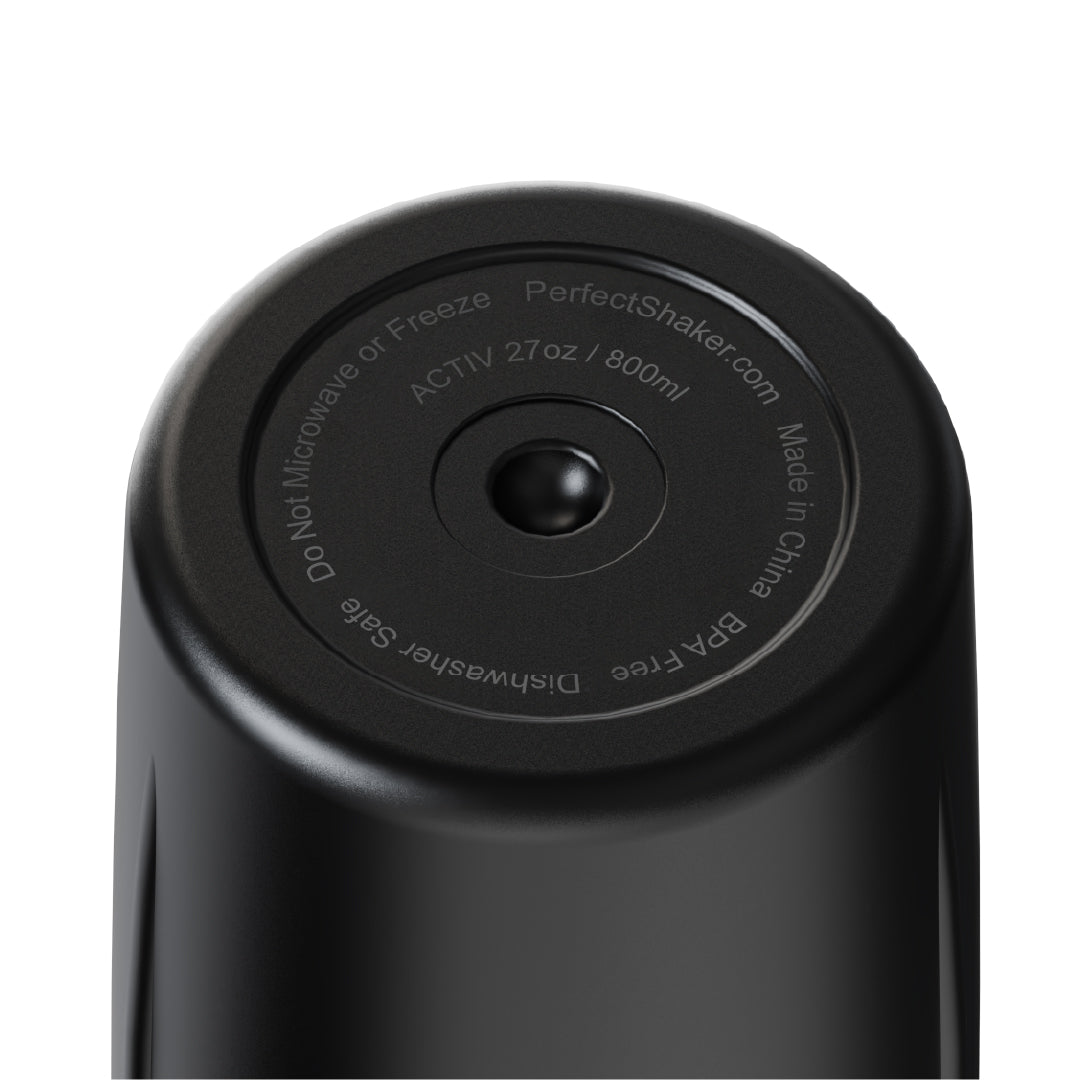 Close-up of the top circular lid of a black PerfectShaker bottle, showing printed text including 'ACTIV 2Tz / 800ml' and 'Made in China' on a white background.