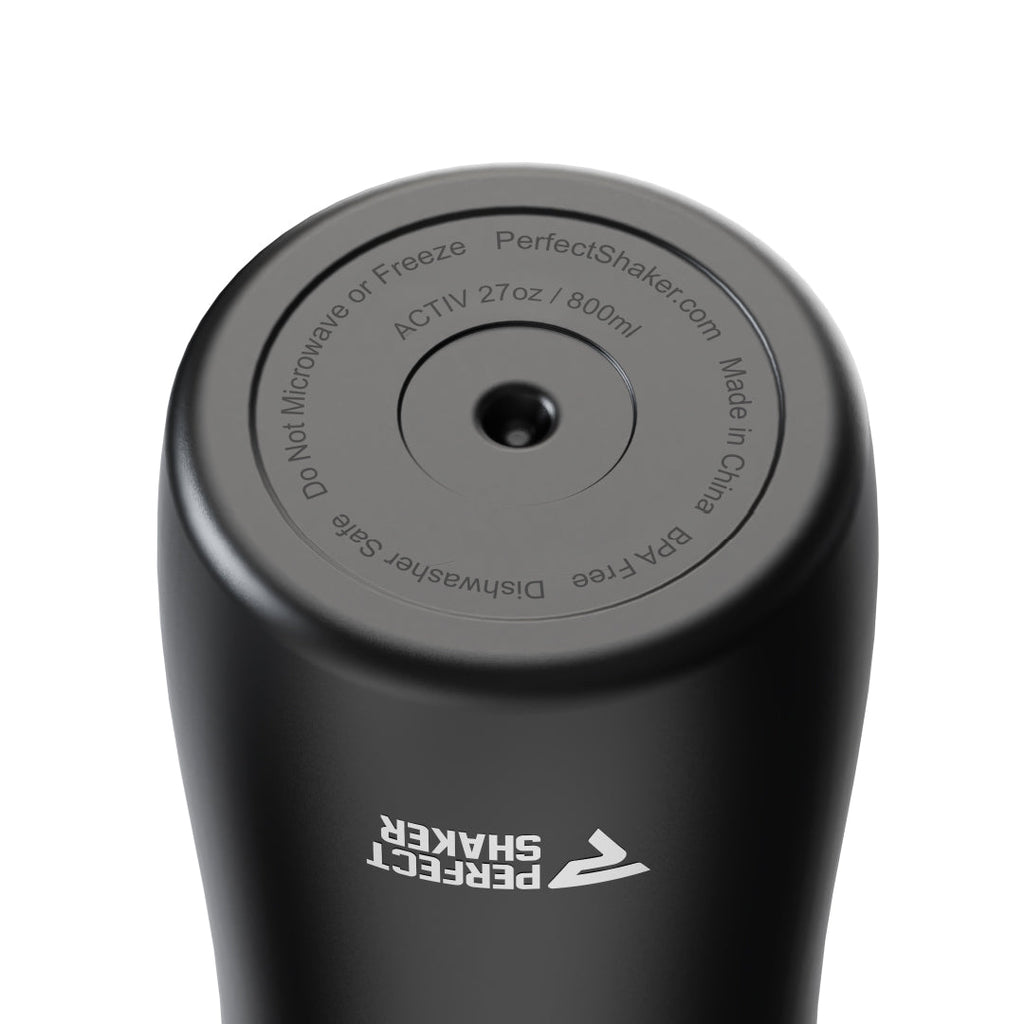 Close-up of the top opening of a black Perfect Shaker insulated tumbler, showing the lid with printed product information and the white Perfect Shaker logo on the side, against a white background.