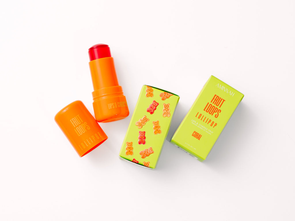 Fruit Loops LOLLIPOP Lips & Cheeks Tint in Coral by Aminnah with vibrant coral lip and cheek color, clean beauty makeup made with natural ingredients, cruelty free, vegan, female owned brand, portable tint stick for a fresh radiant glow.