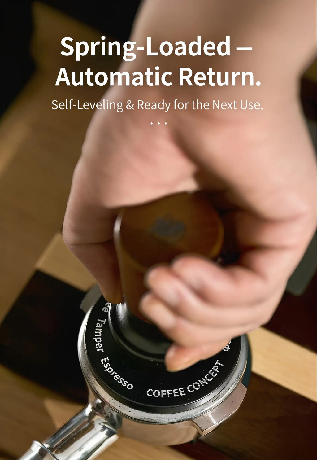 Hand using MUYU constant force spring-loaded self-leveling espresso tamper with walnut wood handle and stainless steel base to evenly compress coffee grounds in a portafilter for consistent espresso shots, smooth extraction and rich crema.