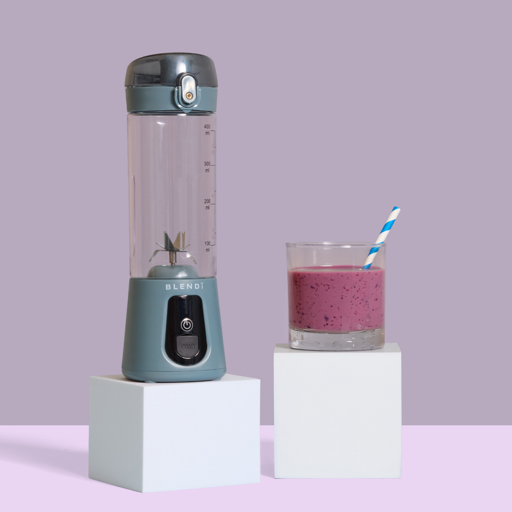Pro+ 17oz portable ice-crushing blender with pink smoothie, travel cup and powerful blades for smoothies, shakes, juices and frozen drinks.