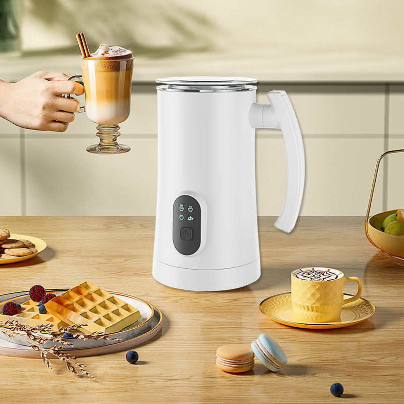 White automatic hot and cold electric milk frother machine with digital controls, ergonomic handle and stainless steel interior for lattes and coffee drinks.