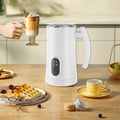 Automatic hot and cold electric milk frother machine with digital controls, creating creamy café-style lattes and foam alongside coffee, waffles and pastries.