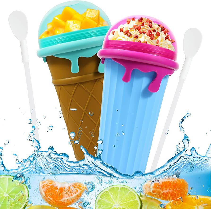Ice cream-shaped reusable slushy maker cups with matching spoons, colorful smoothie freezer cups with fruit and whipped topping, 500ml BPA-free silicone frozen dessert maker in blue and pink.