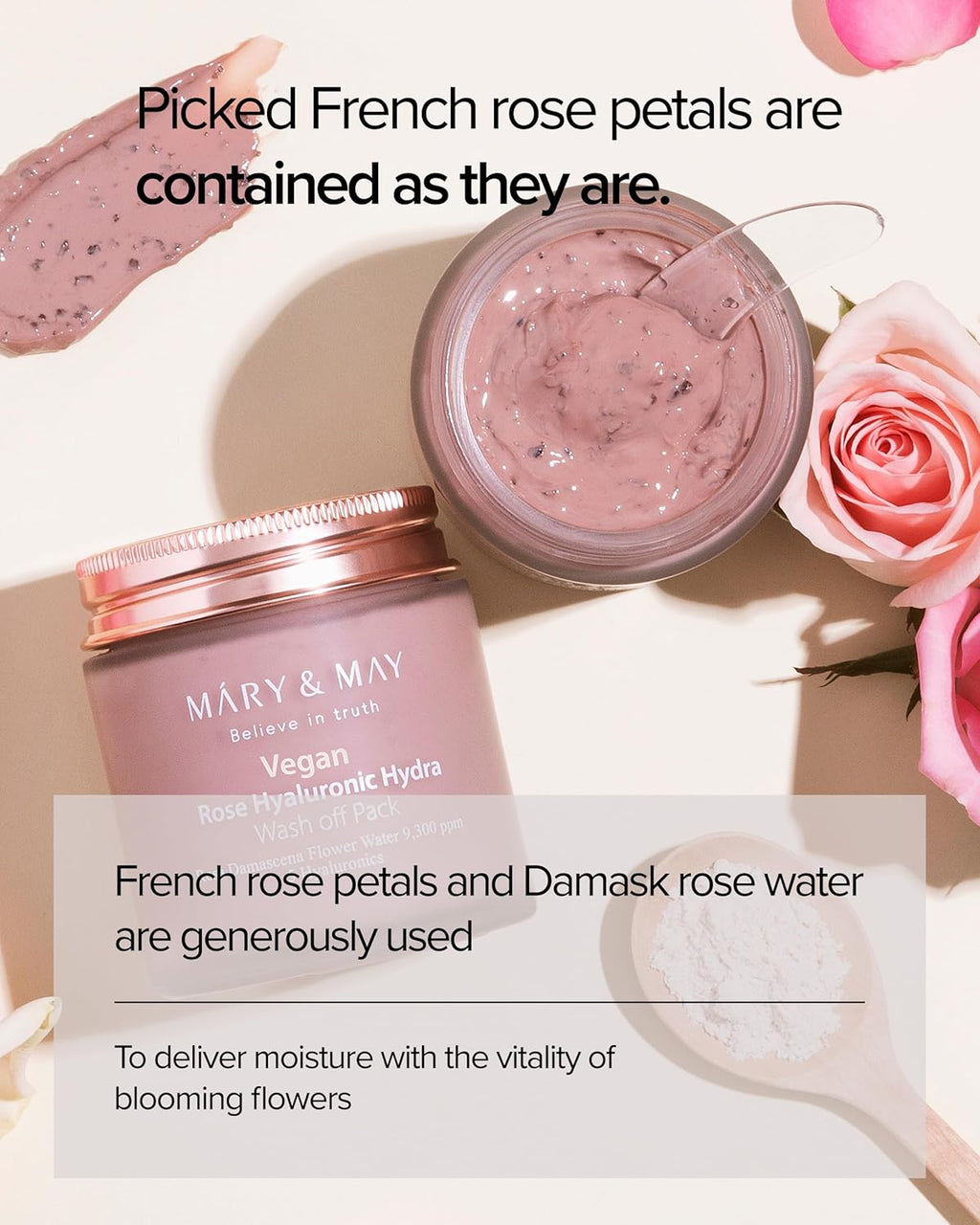 Pink skincare wash-off mask in an open frosted jar with visible French rose petals, surrounded by fresh pink roses and a wooden spoon of powder. Text highlights French rose petals and Damask rose water for deep hydration and blooming skin vitality.