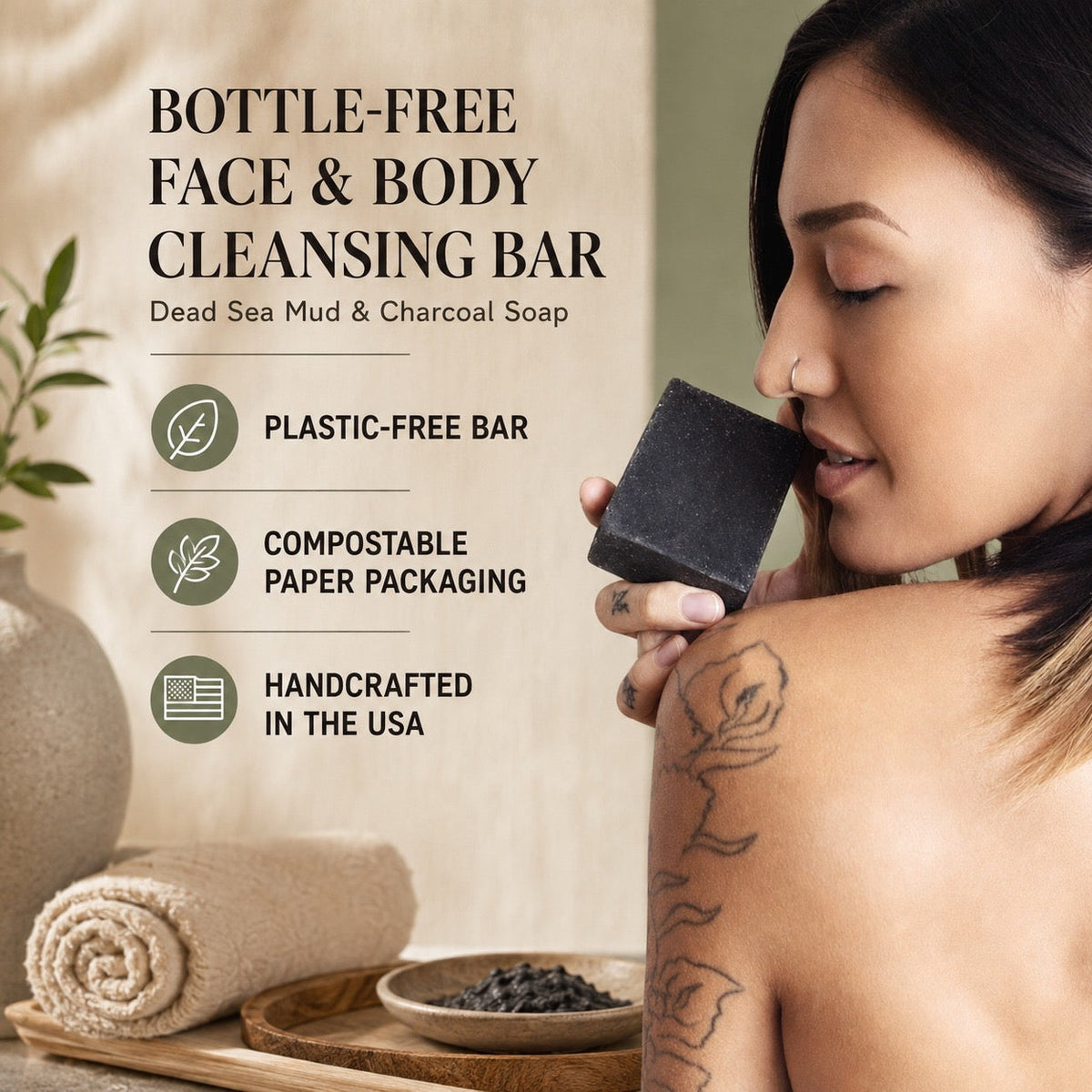 A woman holds a dark charcoal-colored rectangular face and body cleansing bar near her face. The image includes marketing text on the left reading 'Bottle-Free Face & Body Cleansing Bar' and feature icons for plastic-free bar, compostable paper packaging, and handcrafted in the USA.