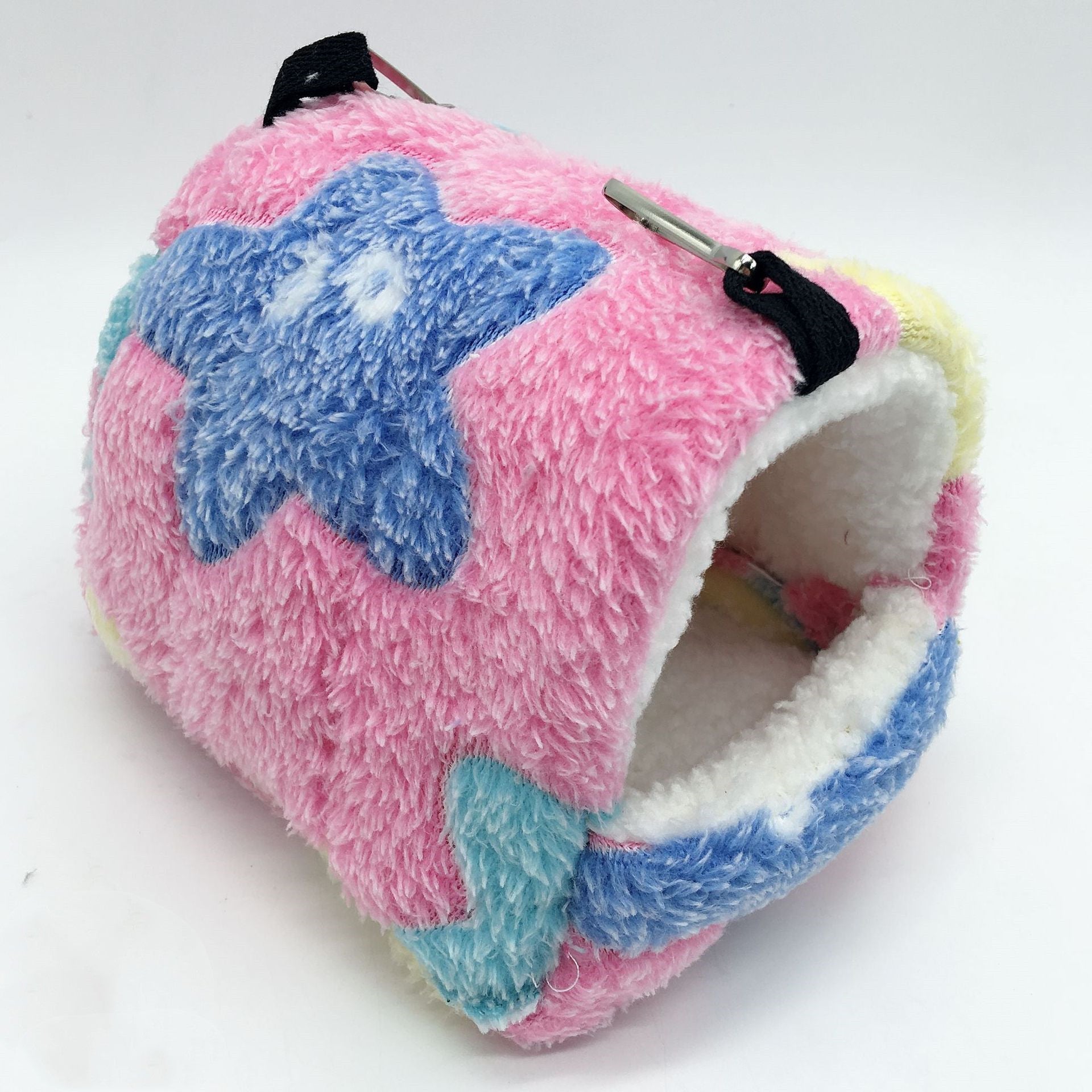 Soft plush hanging hamster sleeping bag nest in pink with blue star pattern, fleece-lined cozy hideaway for hamsters, mice, gerbils, and other small pets.