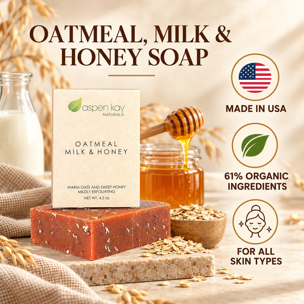 Aspen Kay Naturals Oatmeal Milk & Honey soap bar displayed on a stone slab with a branded box, honey, oats, and milk props, alongside text badges for Made in USA, organic ingredients, and suitability for all skin types.