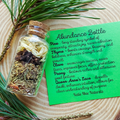 Glass bottle with dried herbs on a wooden surface with a green label