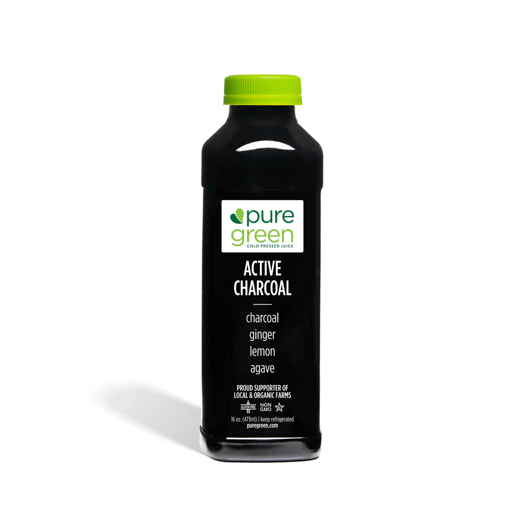 Bottle of pure green Active Charcoal drink on a white background. Pure Green COLD Pressed Juice. Ingredients include: Activated Charcoal, Ginger, Lemon and Agave. Kosher, NON-GMO and Gluten Free Juice Drink.