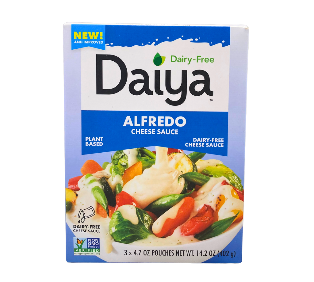 Daiya Dairy-Free Alfredo Cheese Sauce box with plant-based, non-GMO Alfredo sauce pouches, 14.2 oz (3 x 4.7 oz), displayed on a transparent background. This product is a NON-GMO Project Verified cheese source.