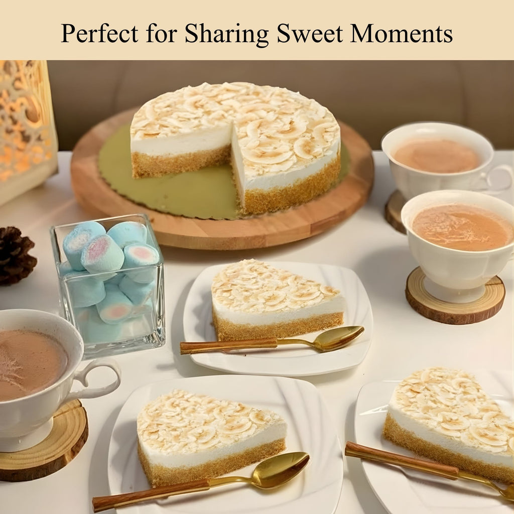Cheesecake with a slice taken out, surrounded by tea cups and decorative items on a table.