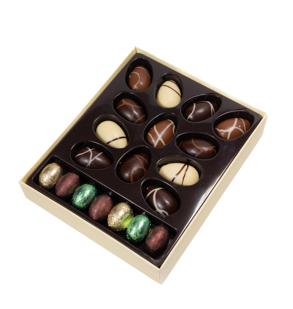 Box of assorted chocolates with a white background