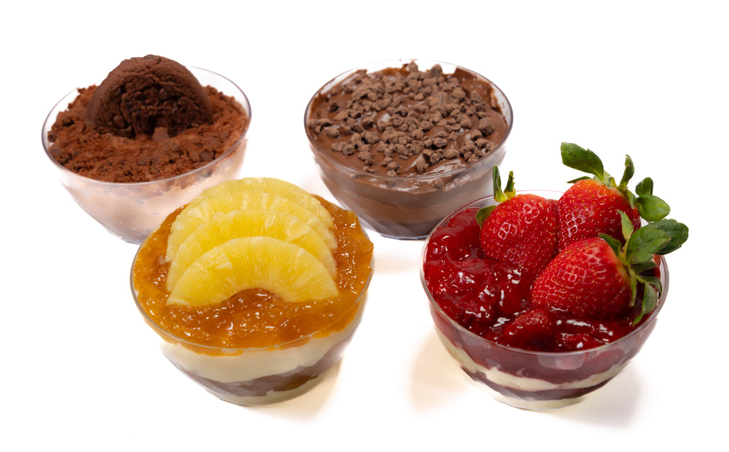 Four dessert cups with different toppings on a white background
