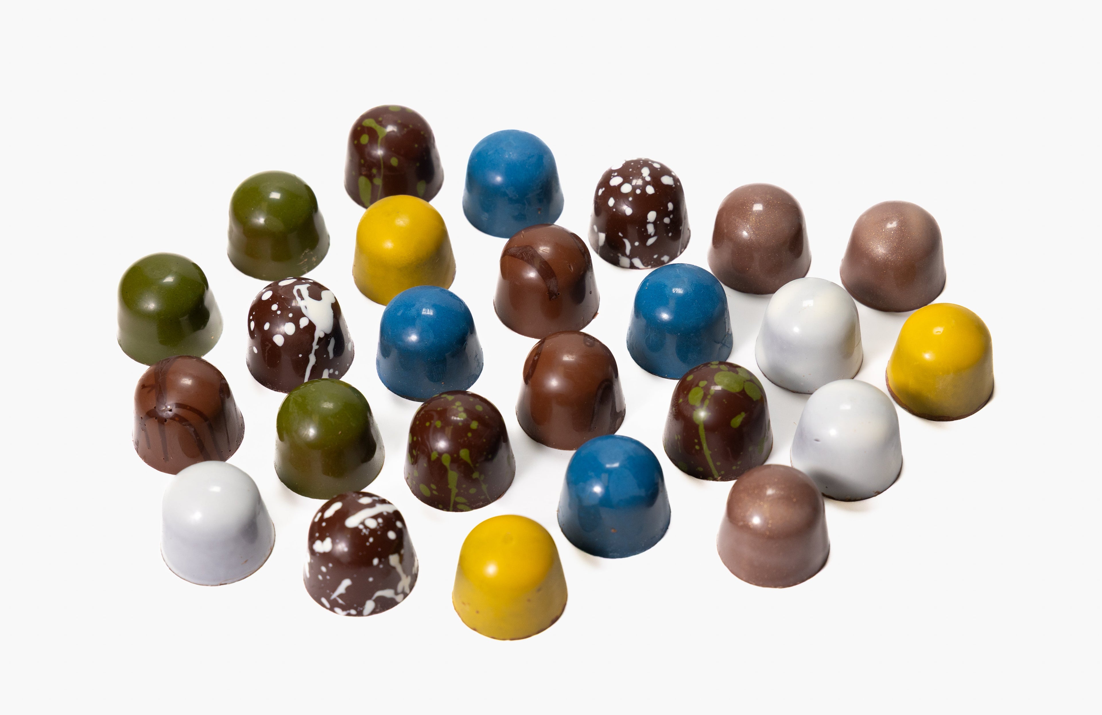 Assorted colorful chocolate candies on a white background