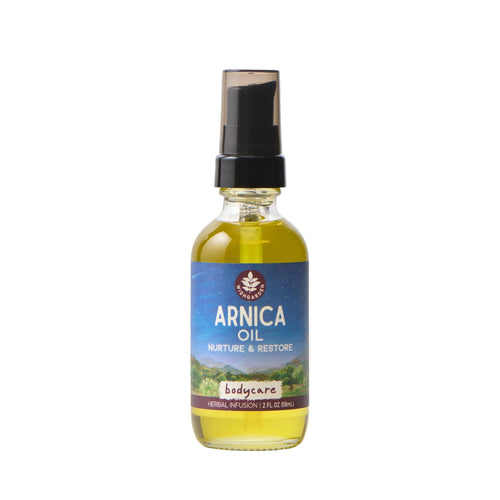 Bottle of Arnica oil with a blue label on a white background