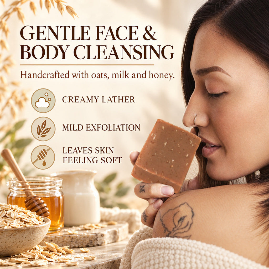 A woman in a cozy setting holds a rectangular bar of brown soap near her face, with text describing gentle face and body cleansing. Ingredients like oats, milk, honey, and a honeycomb dipper are shown in jars and bowls around her.