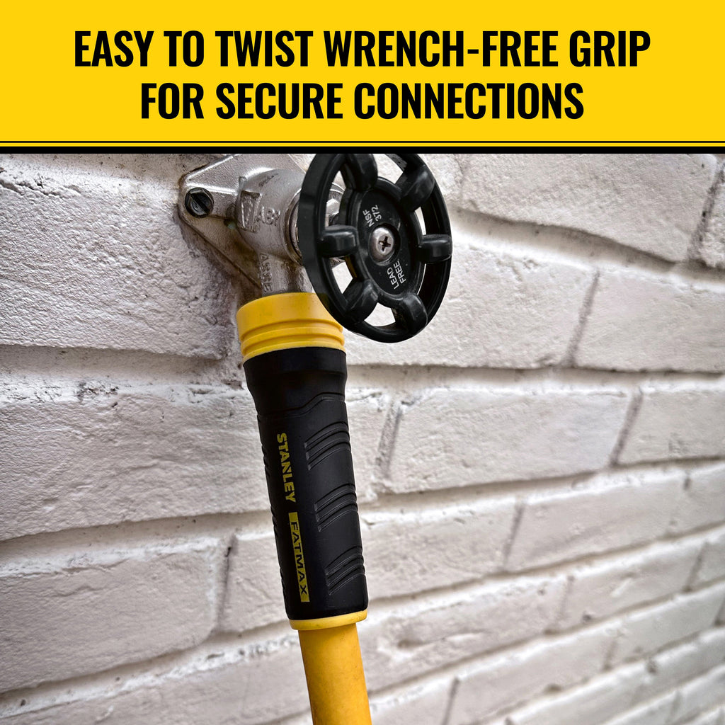 Stanley hose tool with yellow and black handle on a brick wall background. easy to twist wrench-free grip for secure connections.