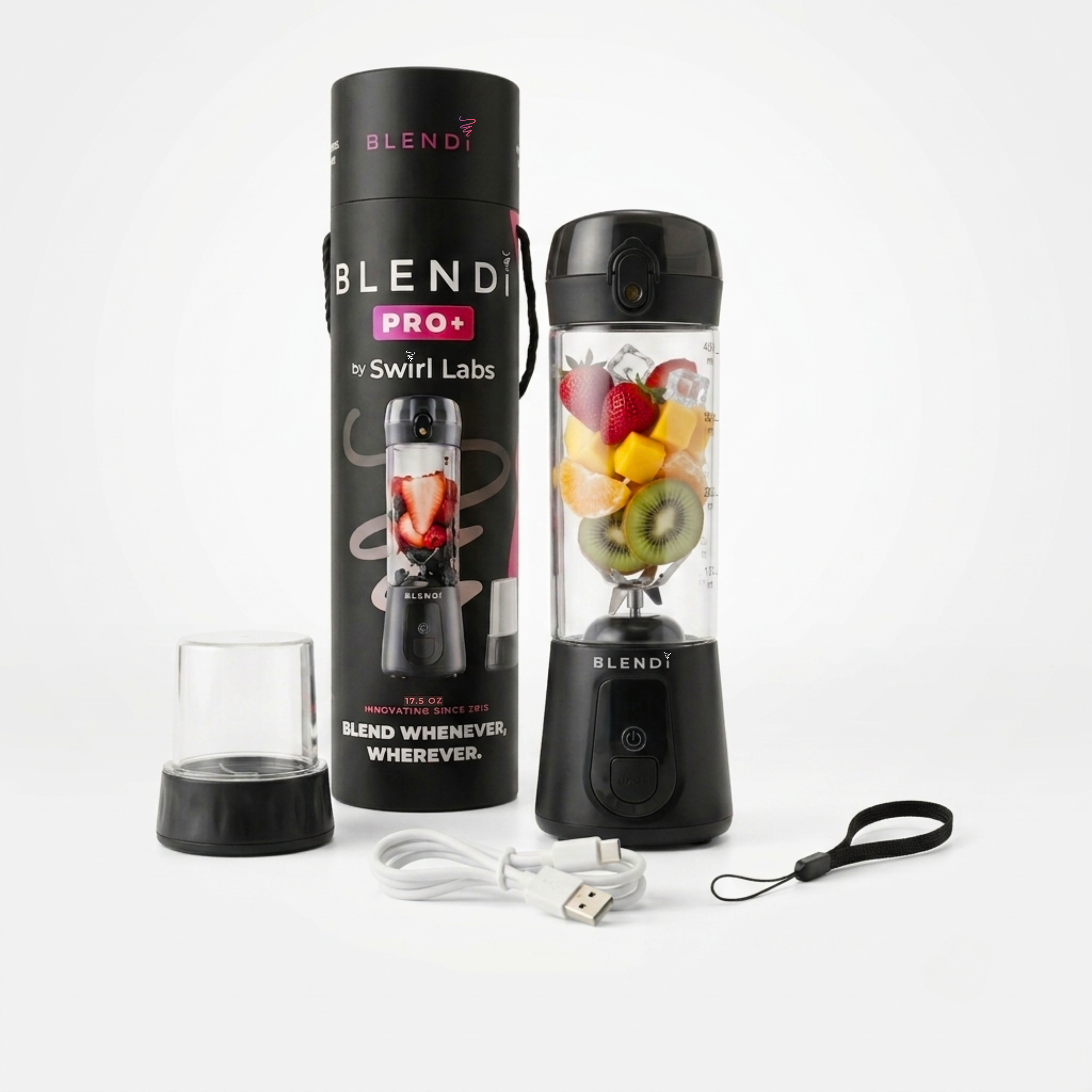 A portable blender set by Blendi Pro by Swirl Labs on a clean white background, including the black blender base, a clear travel cup, a USB charging cable, a wrist strap, and the branded black packaging cylinder. The blender jar is filled with fruit pieces as a demo.