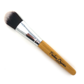 Makeup brush with wooden handle and black bristles on a white background