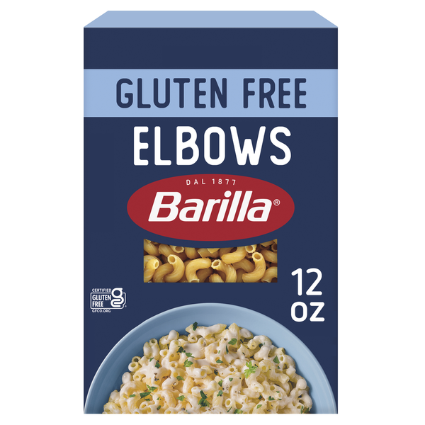 Professional product photography of a box of Barilla Gluten Free Elbows pasta, centered on a clean, solid white background with soft, even studio lighting and sharp focus.