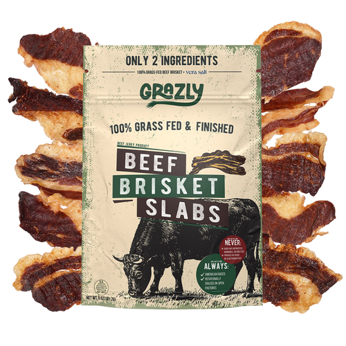 Grozly Beef Brisket Slabs package surrounded by sliced 100% grass-fed and finished dried beef brisket, highlighting a two-ingredient, high-protein beef snack made with beef and sea salt.