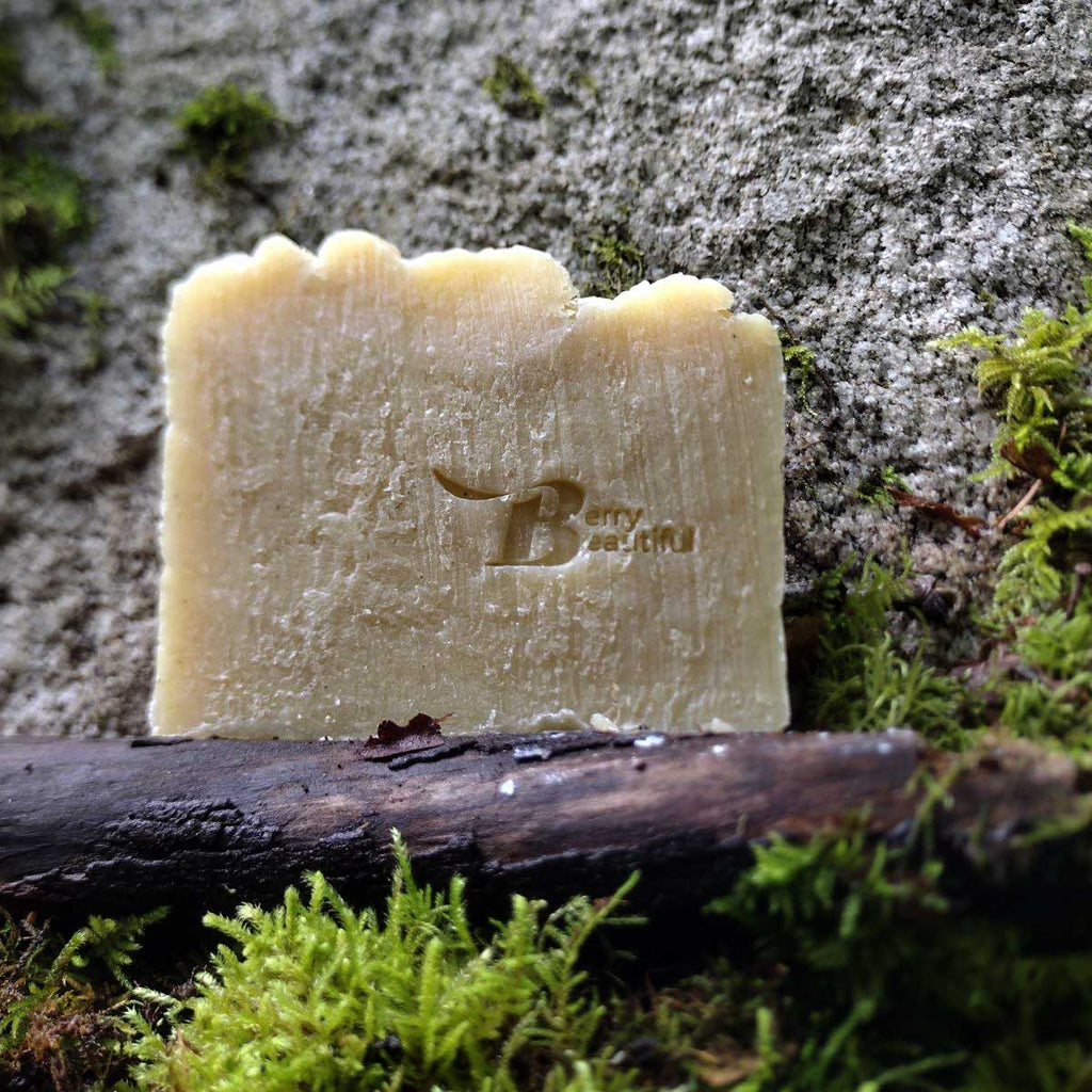 Bar of soap with a brand logo on a natural background