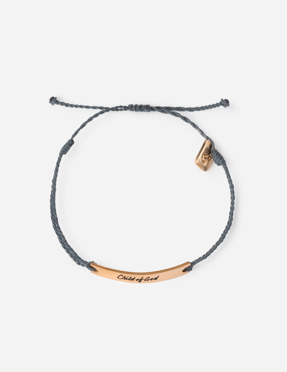 A dark gray braided cord bracelet with a rose gold bar engraved with 'Child of God' and a small matching rose gold charm, shown on a light gray background.