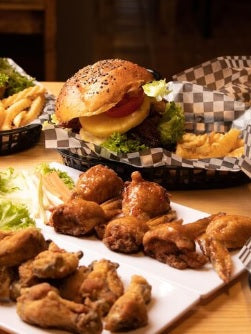 The Gathering Box featuring premium 1/3-pound hamburger patties and pasture-raised chicken wings, perfect for family meals, cookouts, parties, and backyard barbecues.