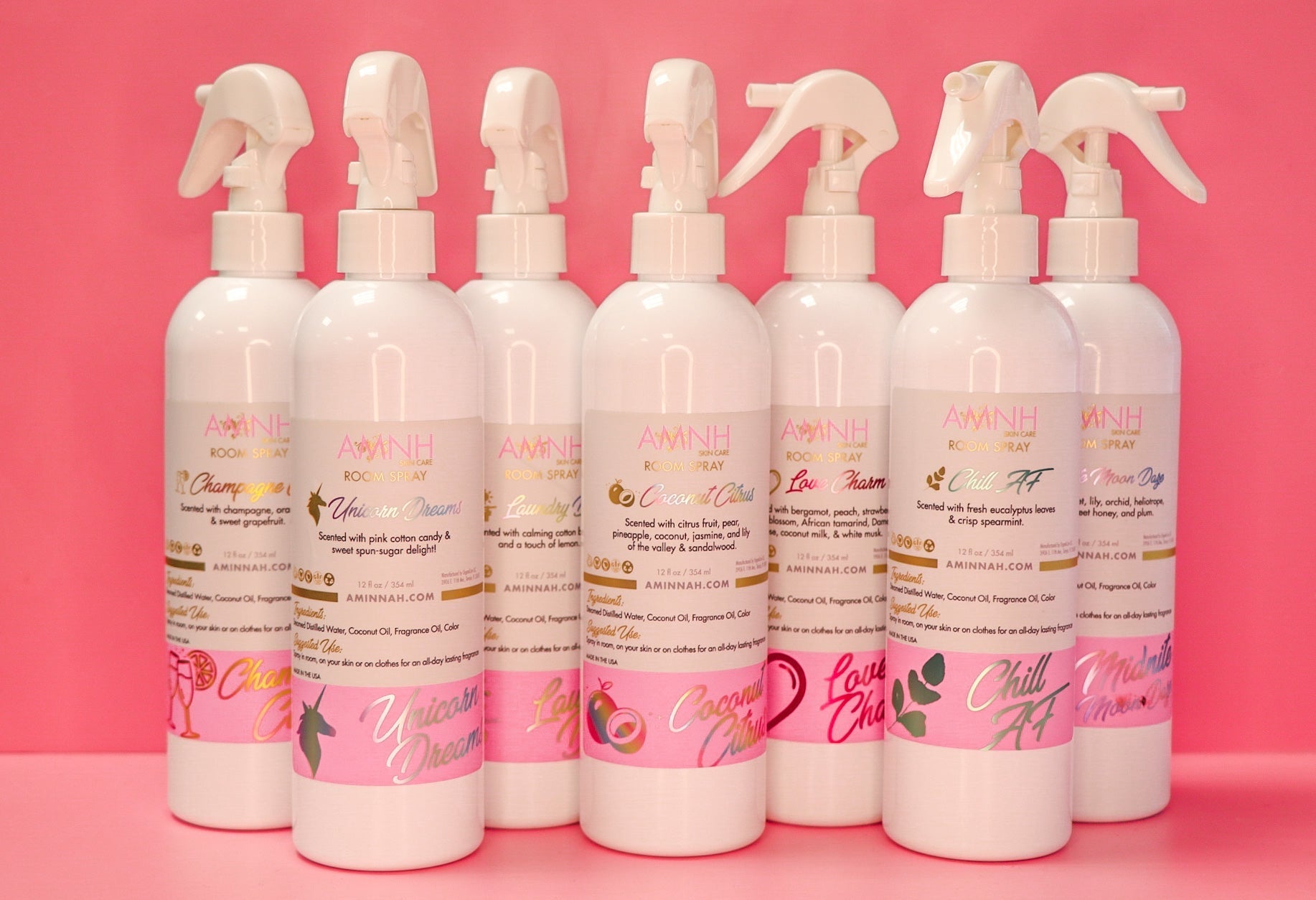 Chill AF Room Spray collection featuring multiple natural alcohol-free home fragrance sprays in assorted scents by Aminnah, a female-owned clean beauty brand, displayed on a soft pink background.