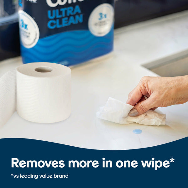 Person wiping a countertop with a sheet of Cottonelle Ultra Clean Strong Toilet Paper. Cottonelle Ultra Clean Strong Toilet Paper, 18 Mega Rolls (72 Regular Rolls), 3X stronger and thicker, soft, septic-safe bath tissue.