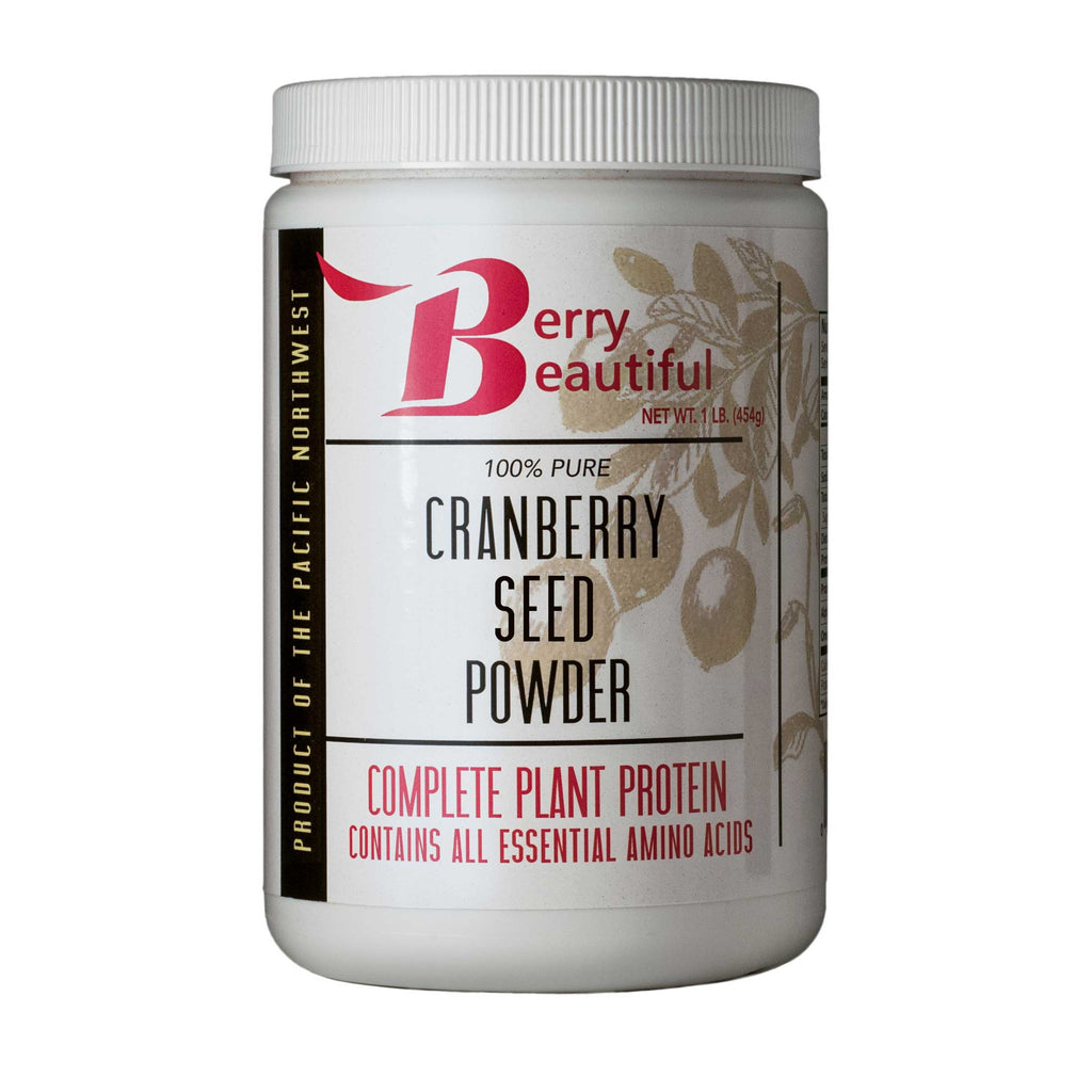Container of Berry Beautiful cranberry seed powder on a white background