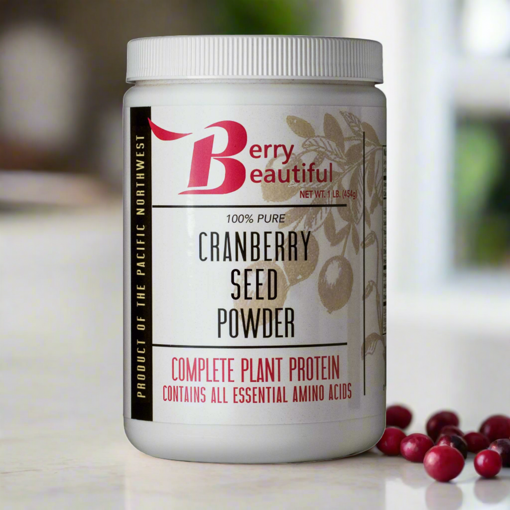 Container of Berry Beautiful cranberry seed powder with cranberries on a blurred background
