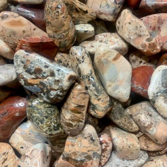 Polished brecciated jasper tumbled healing crystals in earthy red, brown, cream and gray tones for Crystal Lover’s Advent Calendar, meditation, chakra balancing, manifestation and spiritual wellness gifts.
