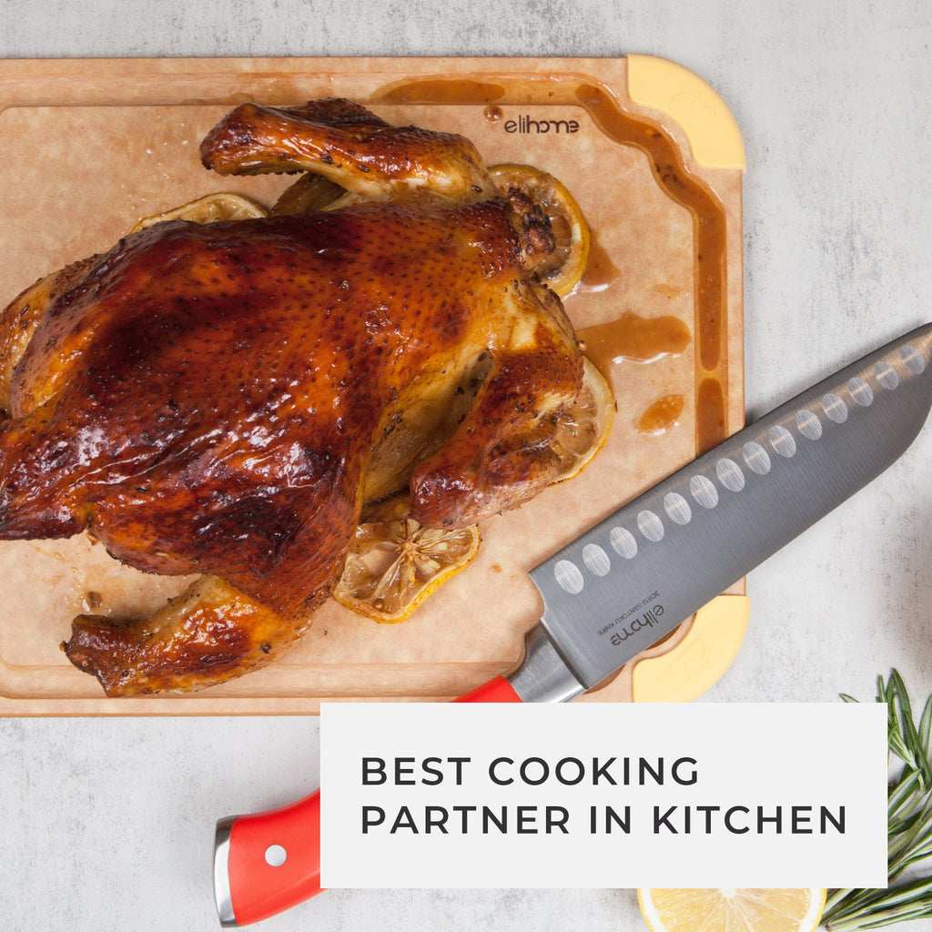 Roasted whole chicken on a premium non-slip color-coded cutting board with a chef's knife, lemon slices, and fresh rosemary, showcasing a durable medium cutting board for safe meat preparation and everyday kitchen use.
