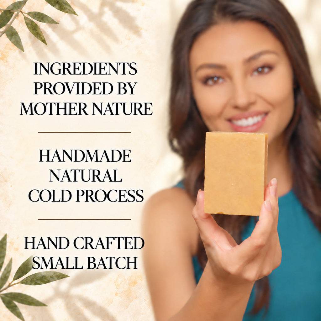 A woman holds up a rectangular bar of natural cold-process soap in her hand, with text on the left reading 'INGREDIENTS PROVIDED BY MOTHER NATURE', 'HANDMADE NATURAL COLD PROCESS', and 'HAND CRAFTED SMALL BATCH'.