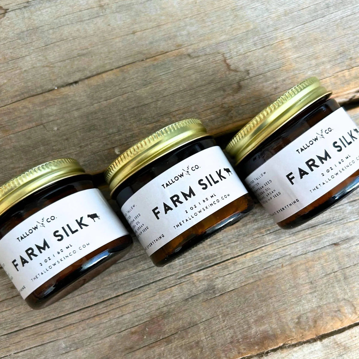 Farm Silk Unscented Tallow Cloud Cream by Tallow & Co. grass-fed beef tallow face moisturizer hydrating nourishing fragrance-free skincare for dry sensitive skin 1 oz and 2 oz jars on rustic wood surface