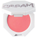 Fenty Beauty Cheeks Out cream blush in a white hexagonal compact with the lid open, revealing a vibrant coral-pink cream blush and the Fenty Beauty logo on the lid.