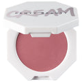Fenty Beauty Cream Blush in a white octagonal compact with the brand name printed on the lid, showing a shimmering dusty rose pink blush powder.