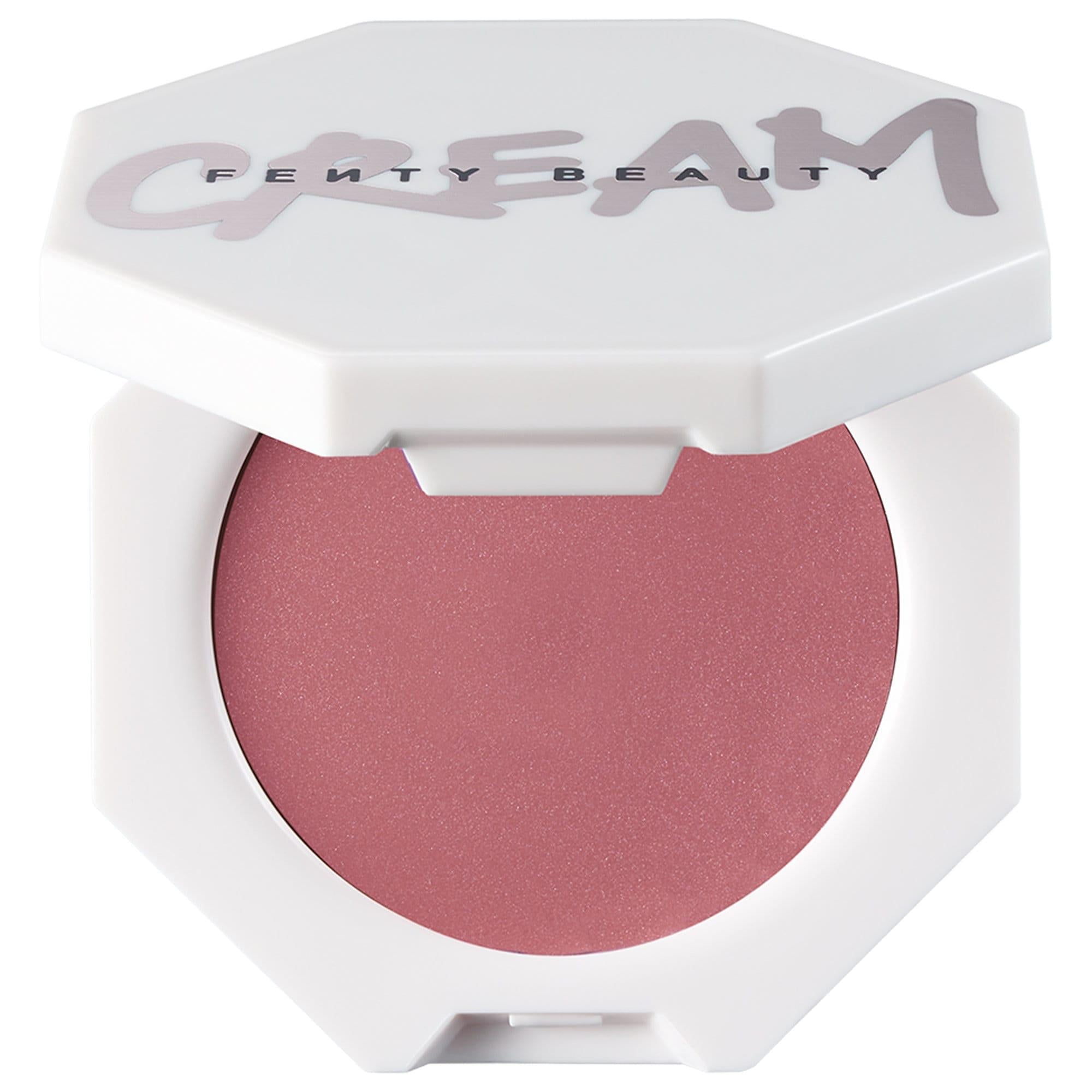 Fenty Beauty Cream Blush in a white octagonal compact with the brand name printed on the lid, showing a shimmering dusty rose pink blush powder.