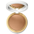 Open white and gold makeup compact featuring a tan crème-to-powder foundation with a smooth matte finish, shown on a clean white background. Fenty Beauty Crème to Powder Skin Foundation - Natural Finish, Medium Coverage, Vegan & Cruelty-Free