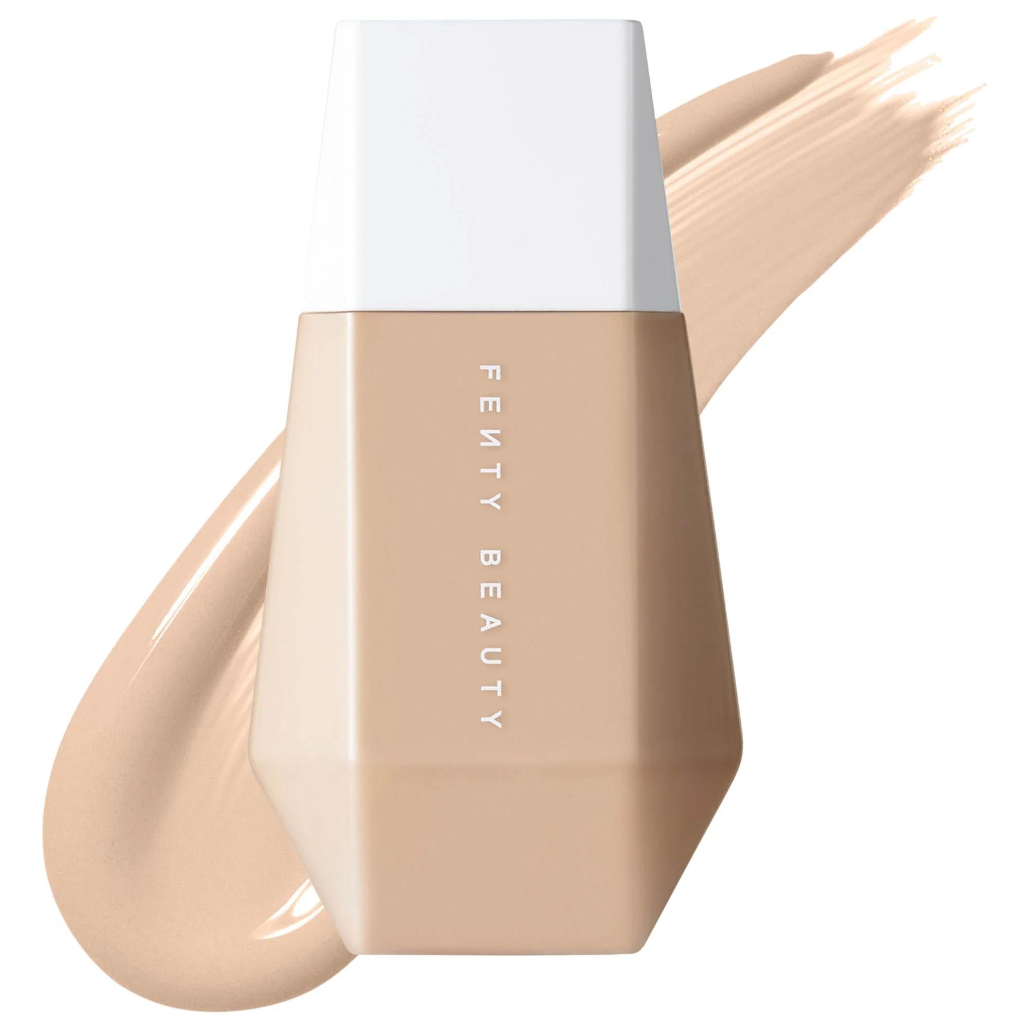 Fenty Beauty foundation bottle with a beige color swatch on a white background. Fenty Beauty Eaze Drop: Blurring Skin Tint Foundation - Lightweight, Buildable Light Coverage for Natural Finish & Vegan Formula