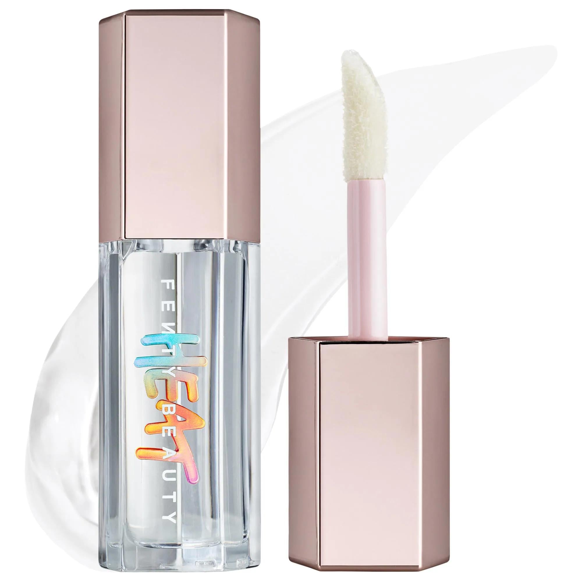 Lip gloss with applicator and hexagonal packaging on a white background. Fenty Beauty Gloss Bomb Heat: Lip Plumper & Luminizer for Fuller, High-Shine Lips | Cruelty-Free Lip Gloss