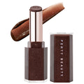 Fenty Beauty Gloss Bomb Stix High-Shine Gloss Stick in shimmering deep brown shade with swatch, vegan hydrating lip color on a white background. Fenty Beauty Gloss Bomb Stix High-Shine Gloss Stick - Vegan, Cruelty-Free, Hydrating Lip Gloss with Vitamin E & Shea Butter