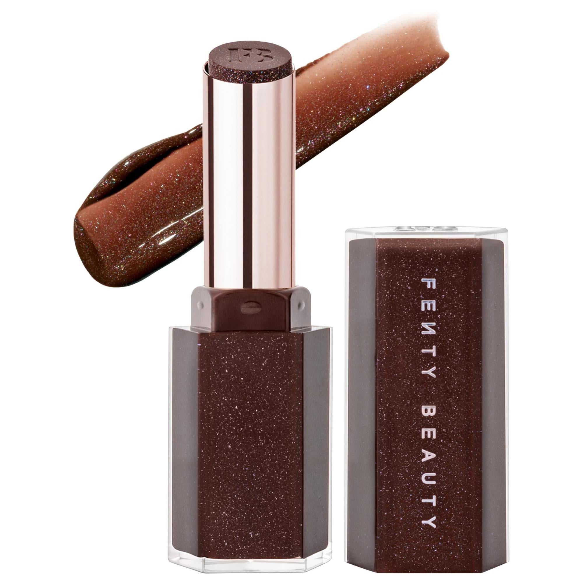 Fenty Beauty Gloss Bomb Stix High-Shine Gloss Stick in shimmering deep brown shade with swatch, vegan hydrating lip color on a white background. Fenty Beauty Gloss Bomb Stix High-Shine Gloss Stick - Vegan, Cruelty-Free, Hydrating Lip Gloss with Vitamin E & Shea Butter