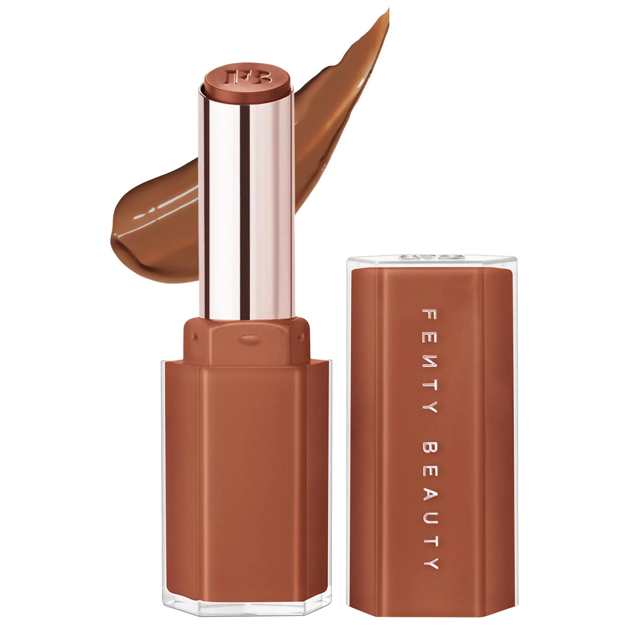 Fenty Beauty Gloss Bomb Stix High-Shine lip gloss lipstick with cap removed, nude brown shade and matching swatch on a white background.