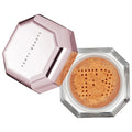 Fenty Beauty Pro Filt'r Loose Setting Powder with open hexagonal compact and powder sifter on a white background