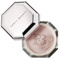 Fenty Beauty Pressed Powder in a clear octagonal jar with a silver-toned lid resting on top. The lid features the Fenty Beauty logo in black text, and the powder inside is a pale pink with a dotted 'FB' logo pressed into it.