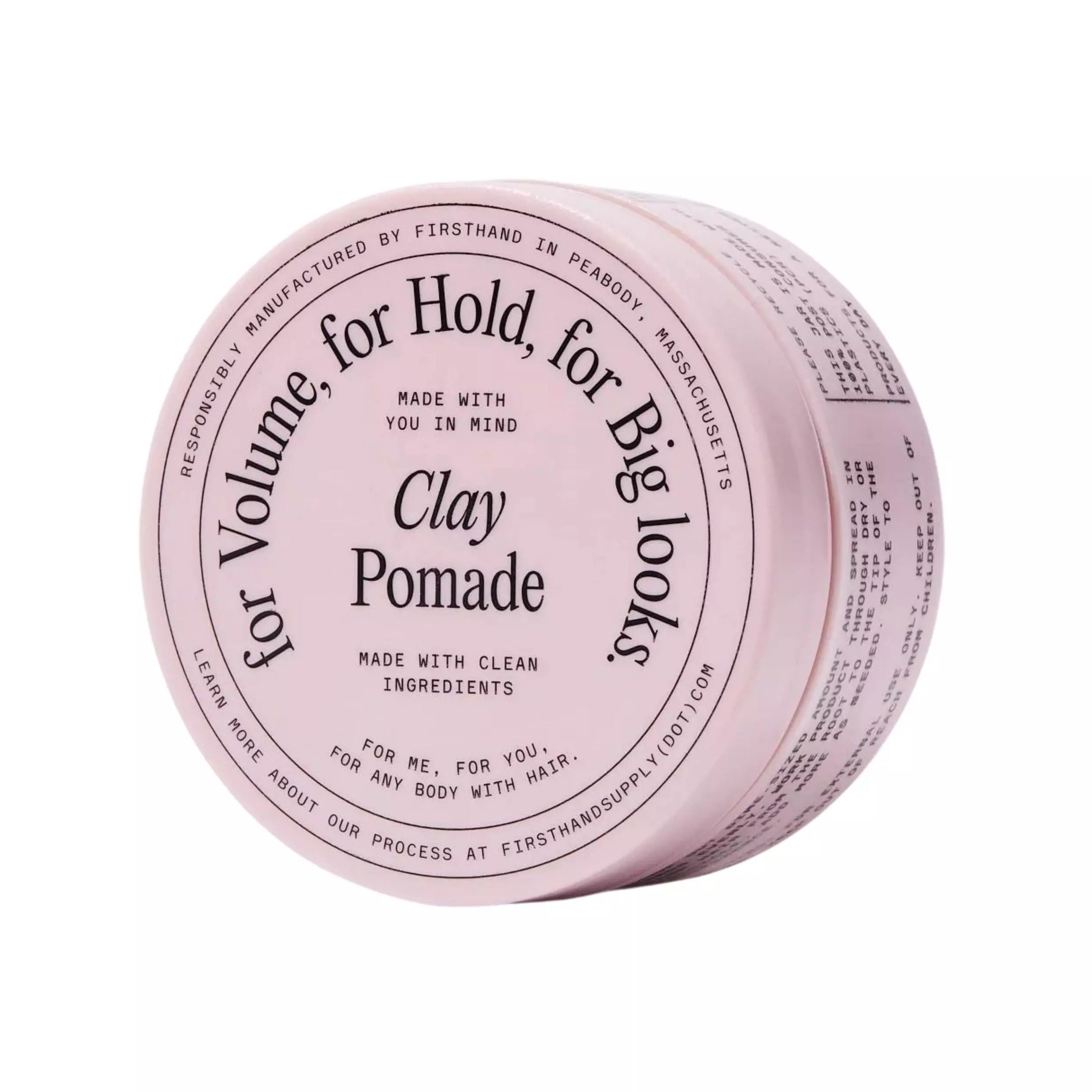 Firsthand Supply Clay Pomade in a light pink jar with a matte finish, strong-hold water-based styling clay for adding volume, texture, and definition to short hairstyles on a white background.